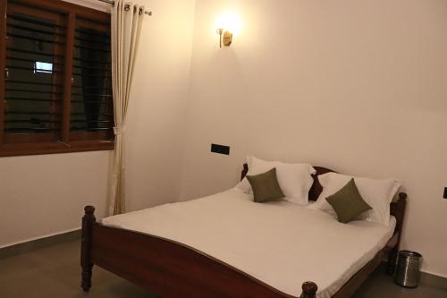 Postel nebo postele na pokoji v ubytování Coffeebean Villa - Unwind & Rejuvenate