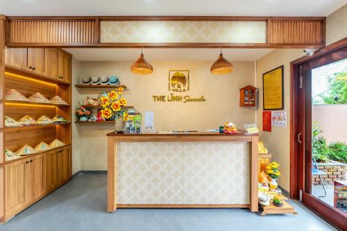 a shoe shop with a counter in a store at The Linh Seaside Villa Hoi An in Hoi An