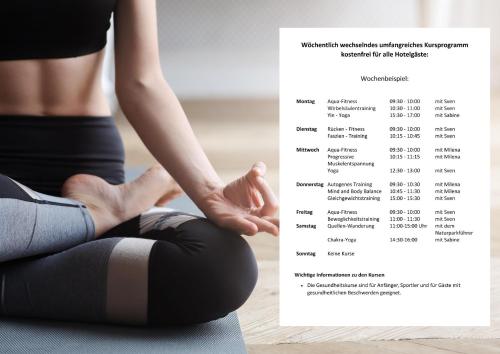 a woman sitting in a yoga pose next to a chart at Göbel`s Hotel Quellenhof in Bad Wildungen