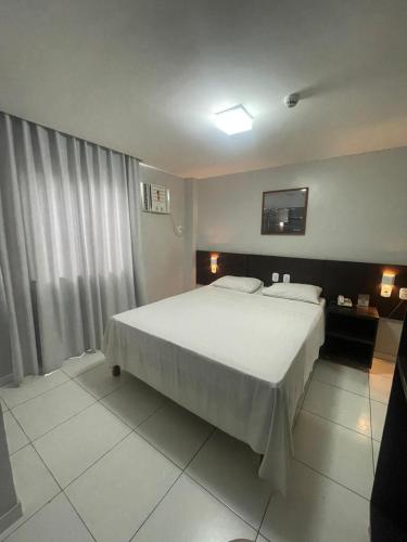 Katil atau katil-katil dalam bilik di Absolutte Hotel