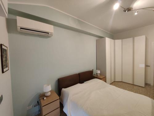 a bedroom with a bed and a air conditioner at Luminoso guest house in Rome