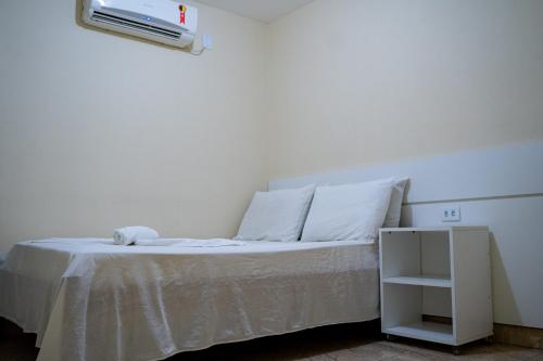 Ένα ή περισσότερα κρεβάτια σε δωμάτιο στο Hotel Santos