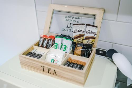 a wooden box filled with different types of food at Rock Mill - Deluxe Studio Apartments in Stoney Middleton