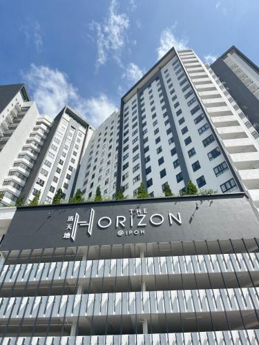 a large white building with a sign on it at The Horizon Ipoh By Iconique Espace in Ipoh