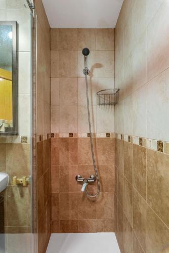 a bathroom with a shower with a sink at Apartamento Zeus - PlusHolidays in Calpe