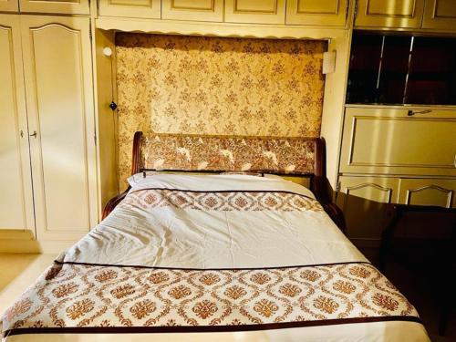 Säng eller sängar i ett rum på Appartement entier sur Paris, pour les Jeux Olympiques 2024