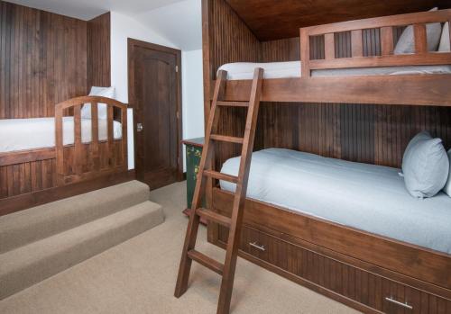 two bunk beds in a room with a staircase at Wildflower Place Unit 5 in Edwards