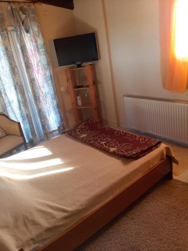 Ένα ή περισσότερα κρεβάτια σε δωμάτιο στο Suburbs Georgia's loft in country side 15' from the Airport