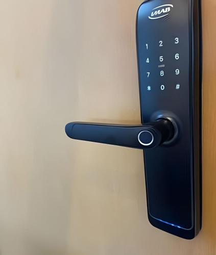 a remote control attached to a wall at New Studios by VLV Stays in Salvador