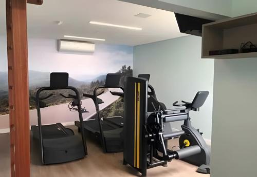 a room with a gym with a view at New Studios by VLV Stays in Salvador