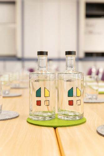 two bottles of water sitting on a table at Hotel Bessunger Forst in Roßdorf