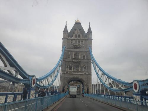 a truck driving over the tower bridge at WALKING TO TOWER BRIDGE in London