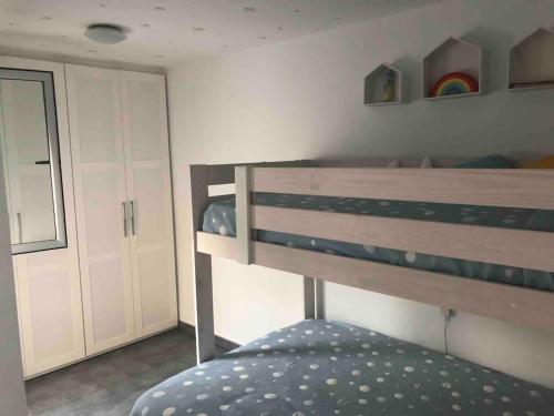 a bedroom with a bunk bed in a room at Ático en Parque Natural Cabo de Gata in Carboneras