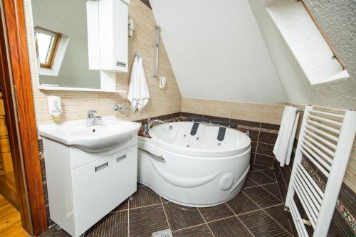 a bathroom with a toilet and a sink at Etno selo Stanišići Hotel Pirg in Dvorovi