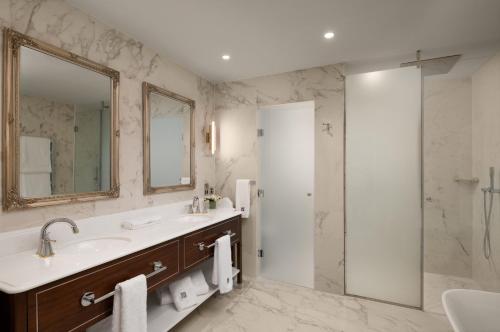 a bathroom with a sink and a shower at Fairmont Windsor Park in Windsor