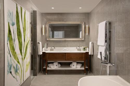 a bathroom with a sink and a mirror at Fairmont Windsor Park in Windsor
