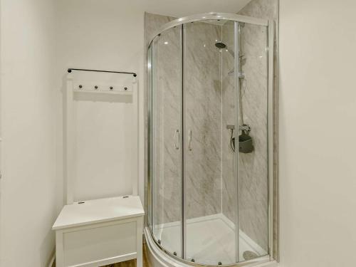 a glass shower in a bathroom with a toilet at 2 bed in Brixham 83741 in Brixham