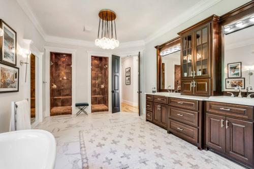 a bathroom with a sink and a mirror at Luxury Mountain Mansion, 7BR, 8 king beds, 10000sf, Views, Pool, Sport Court, Gym, Sauna, Petting Zoo in Blue Ridge