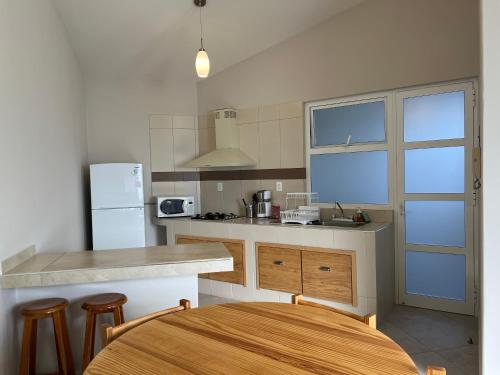 a kitchen with a sink and a counter top at Privada 400 in Pachuca de Soto