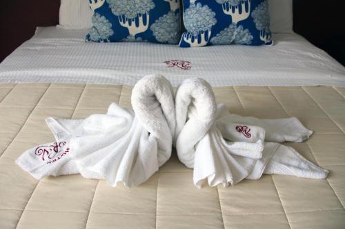 Llit o llits en una habitació de Hotel Reina Victoria
