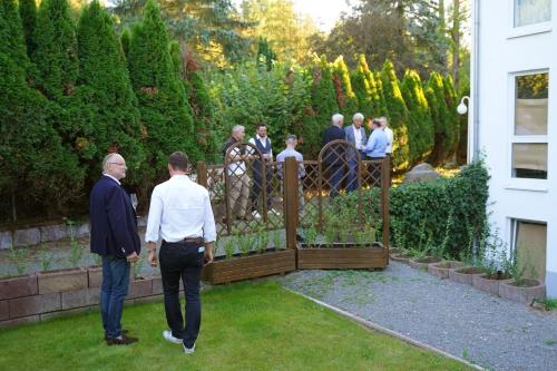 a group of people standing outside of a fence at Hotel Bessunger Forst in Roßdorf