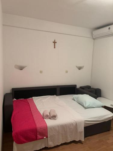 A bed or beds in a room at Apartments Ivanković Medjugorje