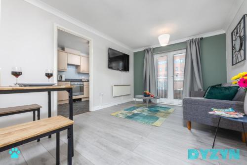 a living room with a couch and a table at WiFi | Parking | Comfort in Cardiff