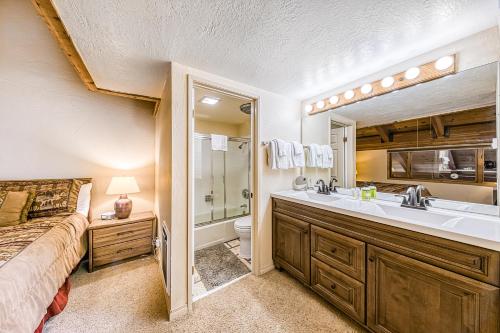 a bathroom with a sink and a toilet and a shower at Courchevel 57 in Mammoth Lakes