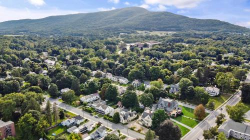 an aerial view of a town with mountains in the background at South Shire in Bennington