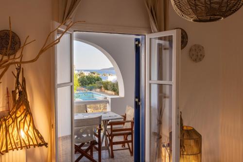an open door leading to a dining room with a view at ACOYA SUMMER HOME in Kampos Paros