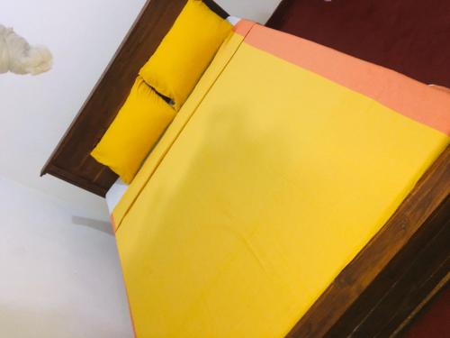 a yellow box sitting on top of a table at BAWANS VILLA Holiday Home for Family or Group in Hikkaduwa