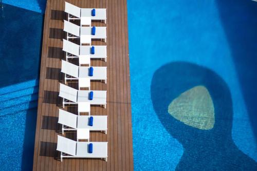 a model of a cruise ship next to a swimming pool at Conrad Manila in Manila