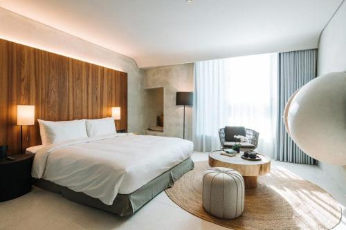 Postel nebo postele na pokoji v ubytování 了了礁溪 Vivir Jiaoxi Hotel