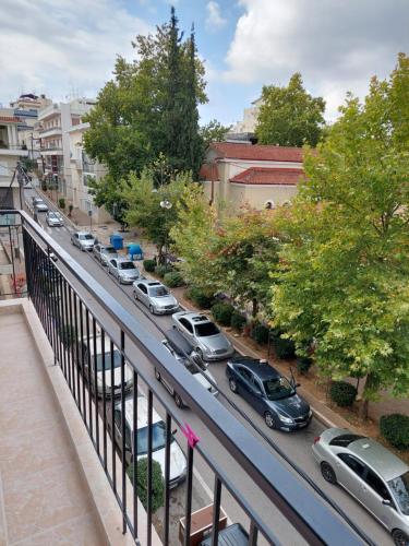 a street filled with parked cars on a city street at Nefeli Β1 apartment in Thiva