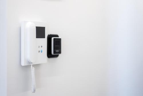 a phone is plugged into a wall at Cozy Apartment in Kalamaria, Thessaloniki in Thessaloniki