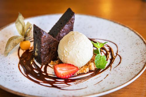 a plate of dessert with ice cream and chocolate at Meliá Paulista in Sao Paulo