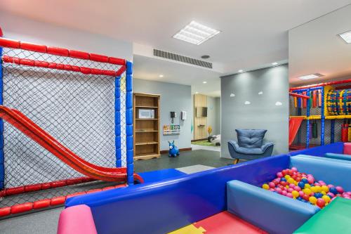 a kids play room with a inflatable at Meliá Paulista in Sao Paulo