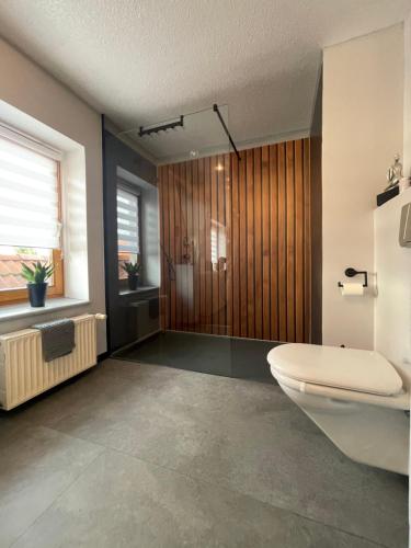 a bathroom with a white toilet and a window at Elbinger Str. 28 in Hildesheim