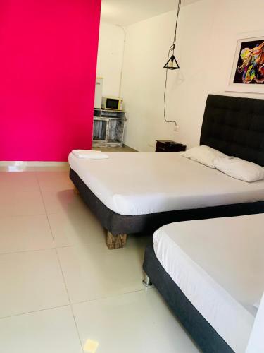 Postel nebo postele na pokoji v ubytování La Clave Hostel