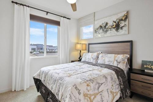 a bedroom with a large bed and a window at The haven @ Roc Sac in Rocklin