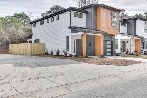 a white and orange house with a driveway at 2 Mi to Historic Dtwn Wilmington Luxe Family Home in Wilmington