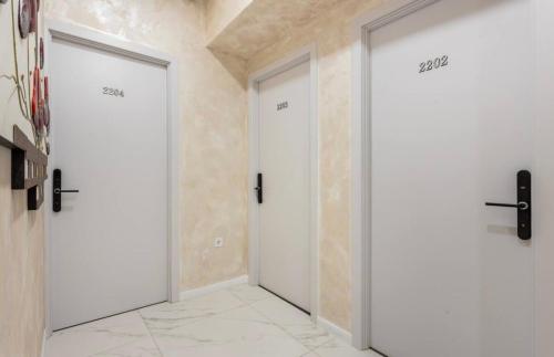 a hallway with two doors in a room at Hotel Babi in Tbilisi City