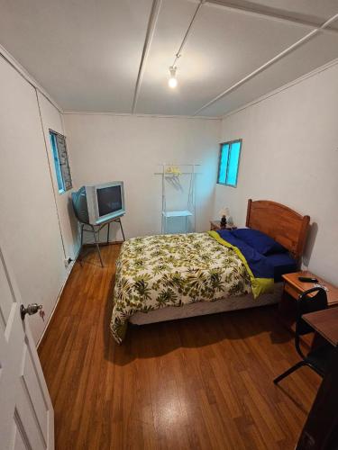 Ένα ή περισσότερα κρεβάτια σε δωμάτιο στο POSADA COPACABANA