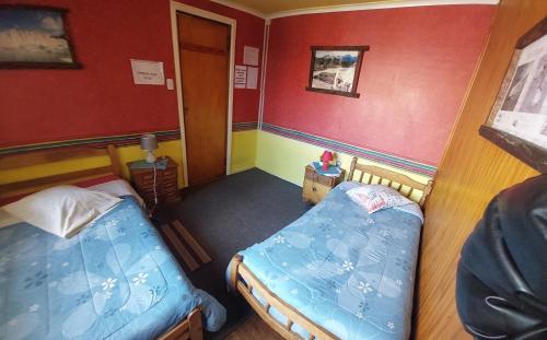 Cama o camas de una habitación en Hospedaje Independencia y camping