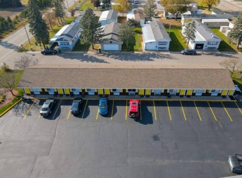 an aerial view of a parking lot with a train at #28 Snooze in Wisconsin Rapids