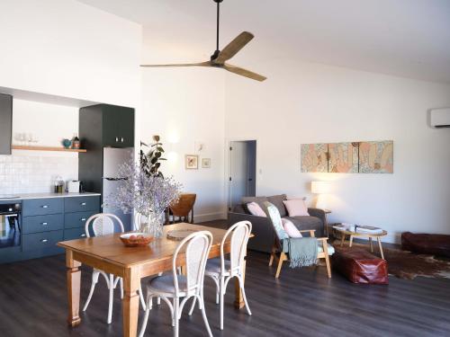 a living room with a table and a couch at Shawwood Estate in Mudgee