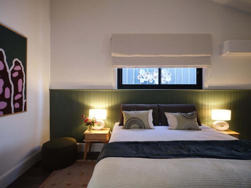 a bedroom with a large bed and a window at Shawwood Estate in Mudgee