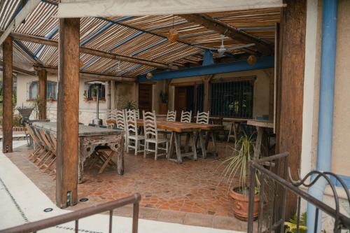 a patio with a ping pong table and chairs at El EQUIMITE HOTEL BOUTIQUE in Coatepec