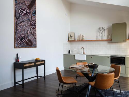 a kitchen and dining room with a table and chairs at Shawwood Estate in Mudgee