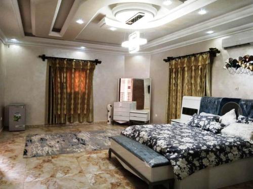 a bedroom with a bed and a couch in it at wonderful and distinctive villa that you will love in Nouakchott